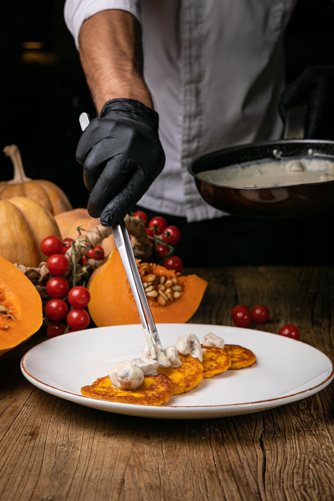 chef preparing seasonal plate in studio kitchen